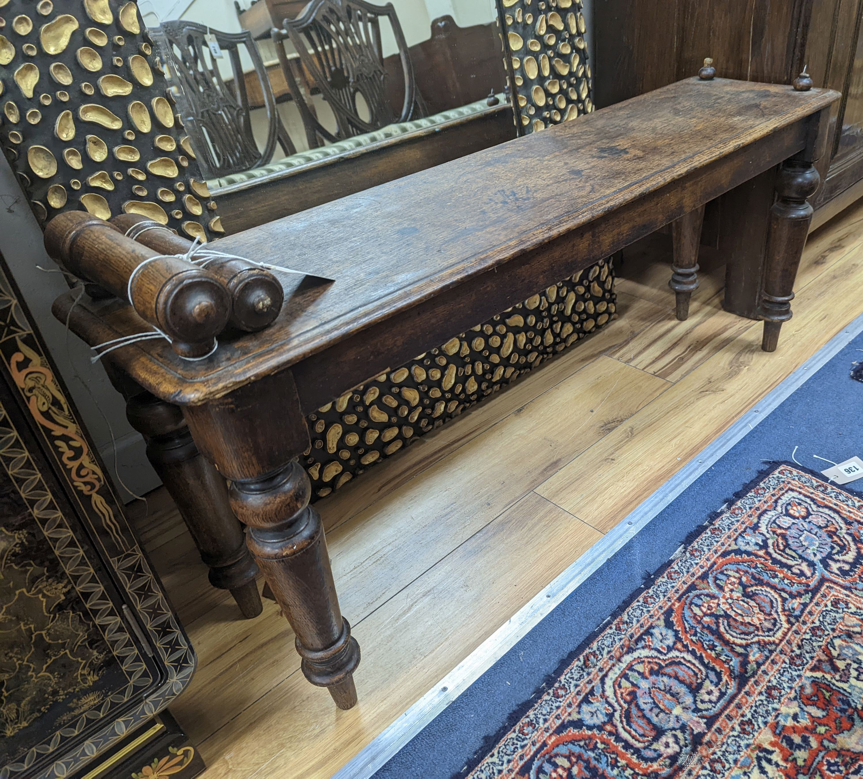 A Victorian oak window seat W-107cm, D-28cm, H-53cm, one handle bar detached but present